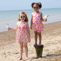 Bobbie's Shoppe pink cotton ice cream print short set with scalloped edges and bows on the front.